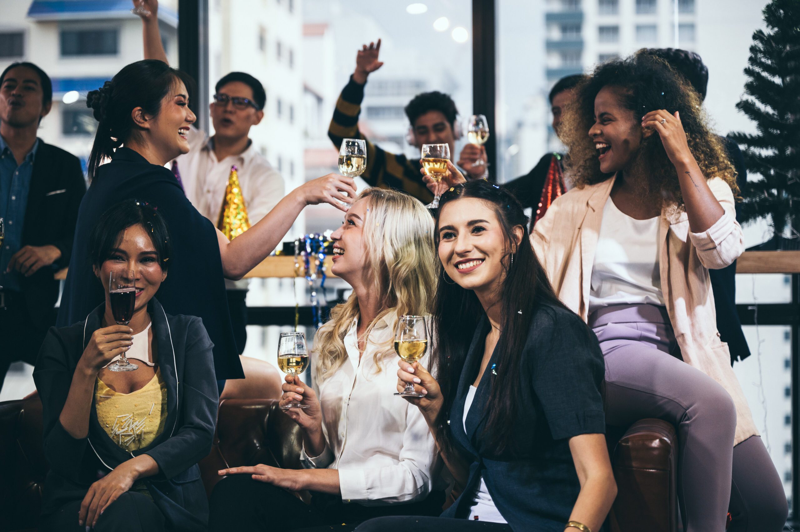 Coworkers enjoying festivities at their company holiday party