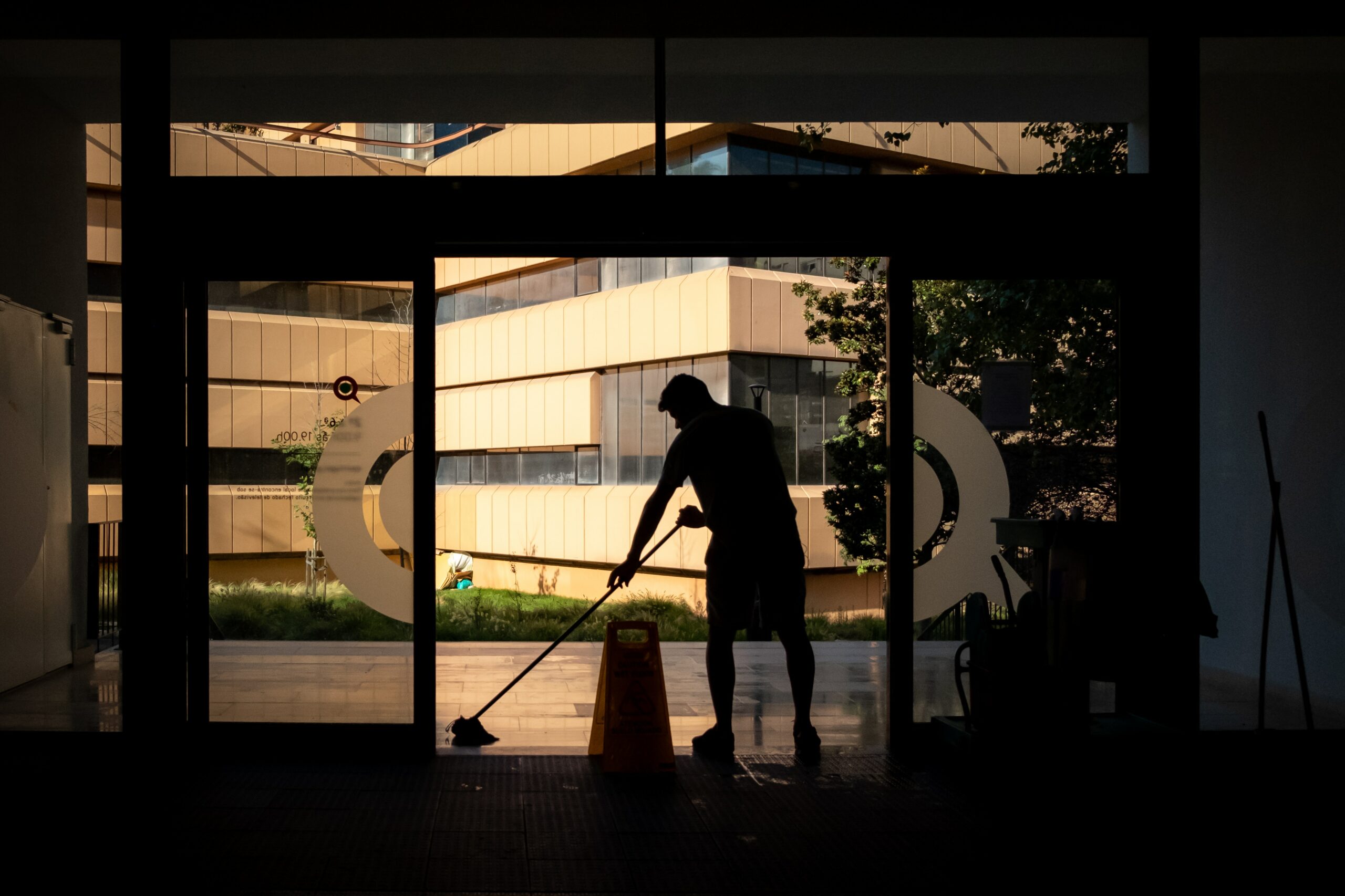 man cleaning entryway as cleaning service in sparks